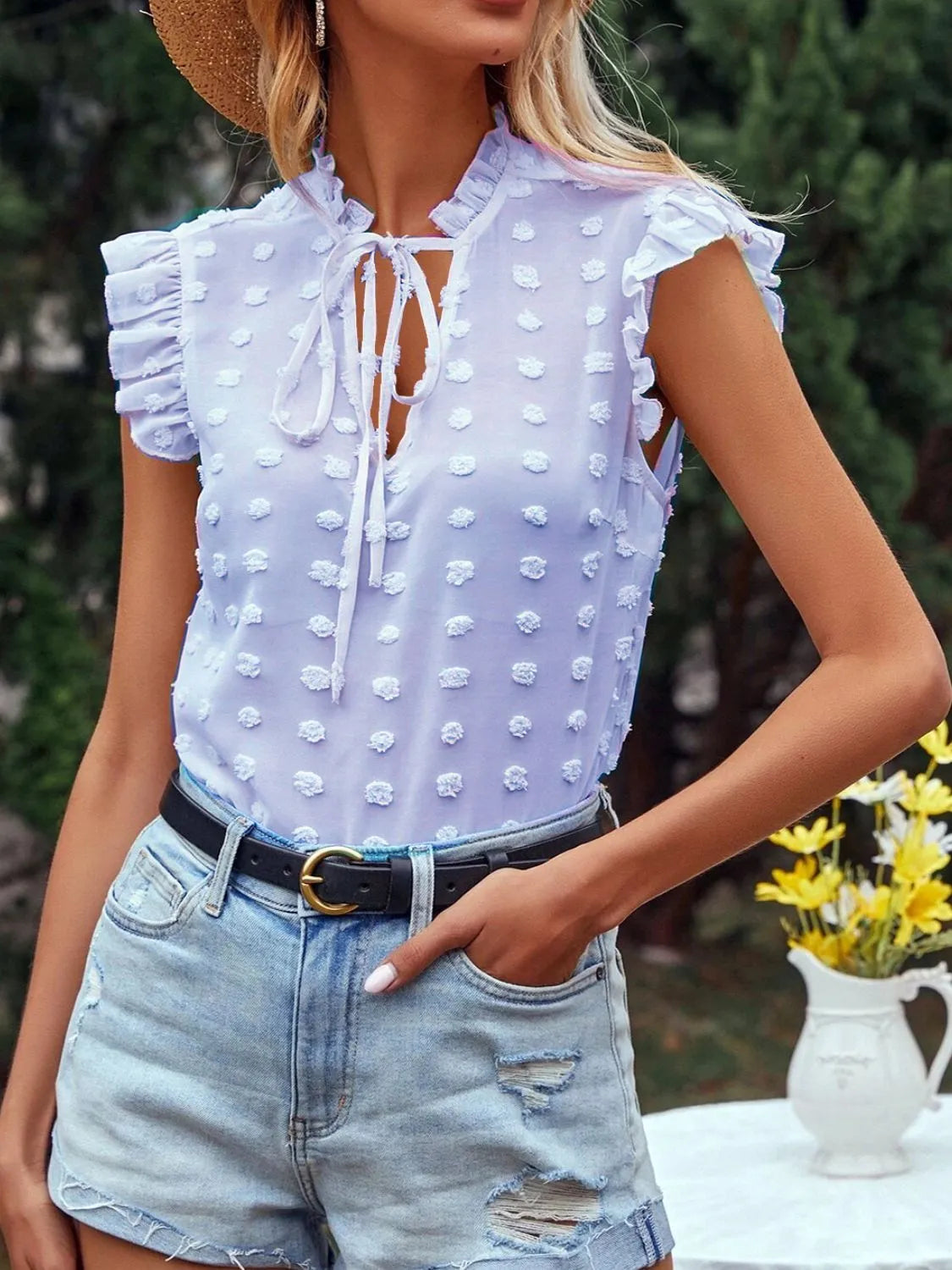 Elegant blouse with dots, high collar, and ruffle for woman