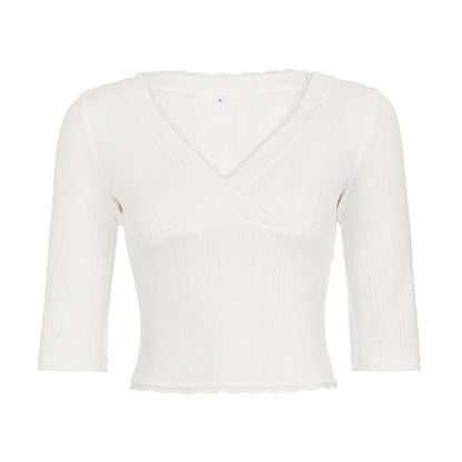 Top femenino ajustado liso versátil