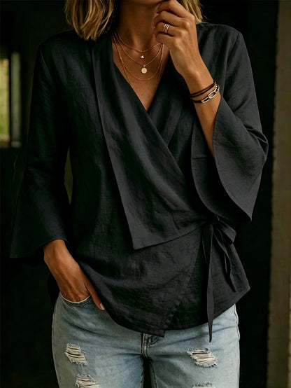 Asymmetric women's blouse with lapels and flared sleeves