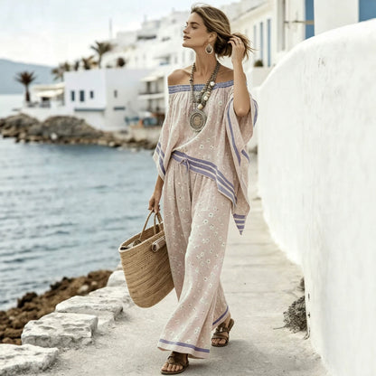 Women's asymmetrical top with one shoulder exposed and wide high-waisted pants - Modern and chic