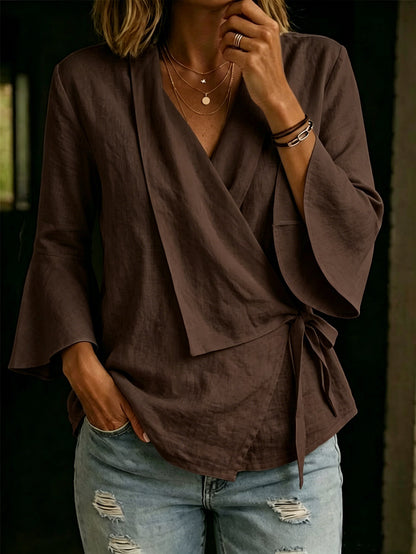 Asymmetric women's blouse with lapels and flared sleeves