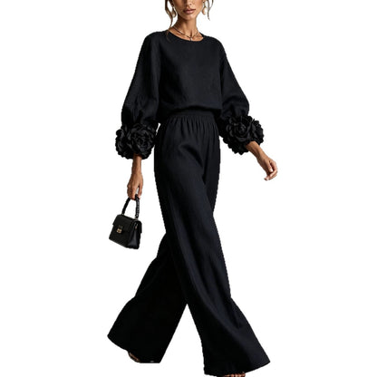 Women's outfit with floral-cuff top and wide-leg trousers – Casual chic