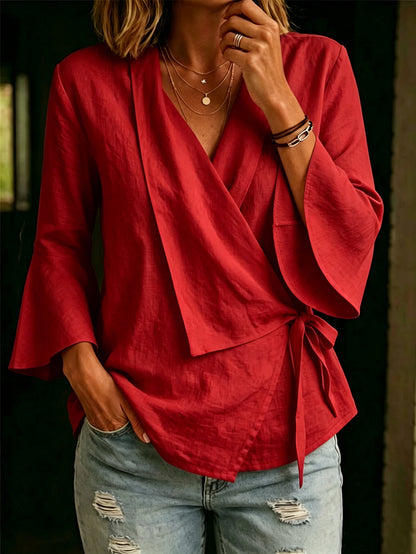 Asymmetric women's blouse with lapels and flared sleeves