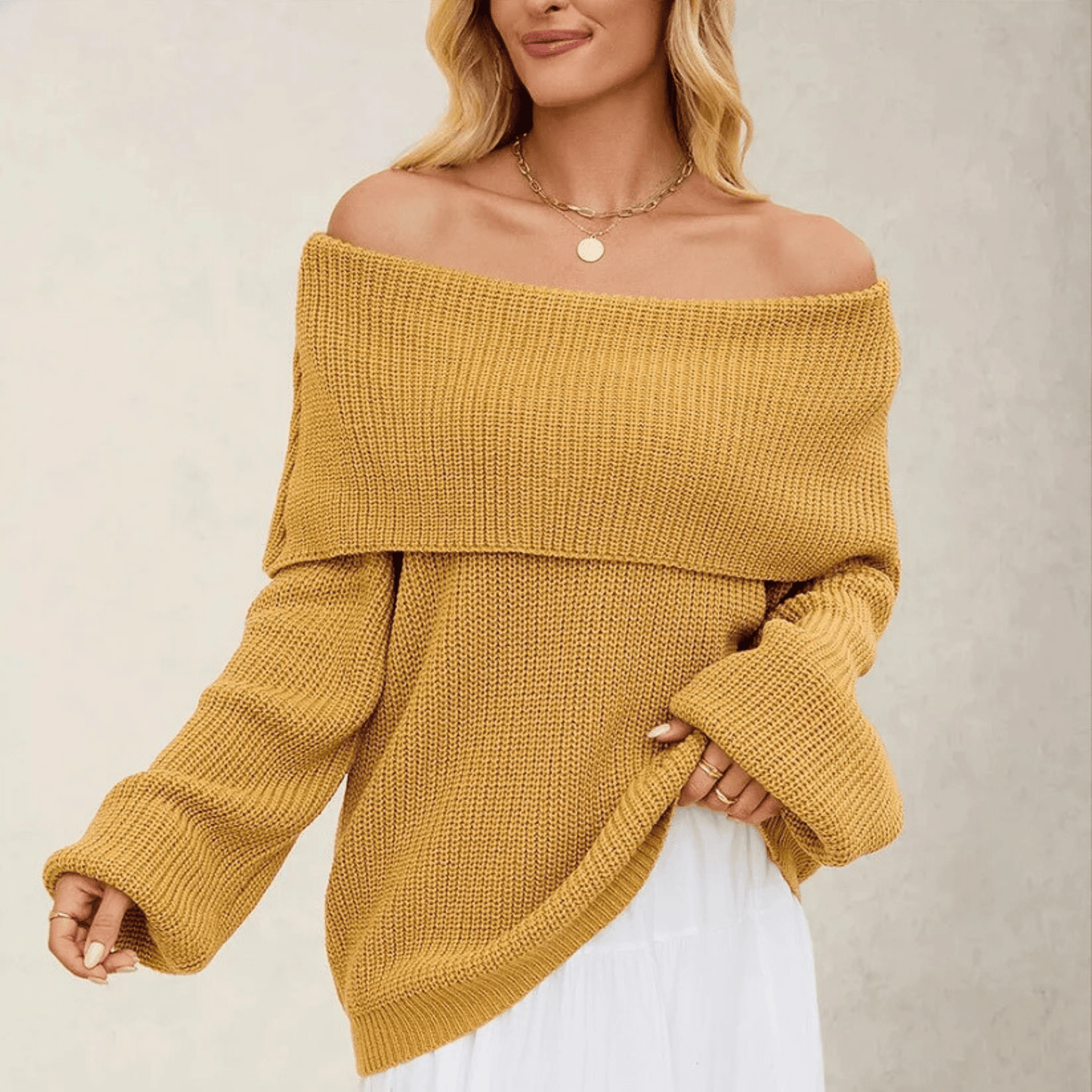 Off-the-shoulder women’s sweater in soft knitwear