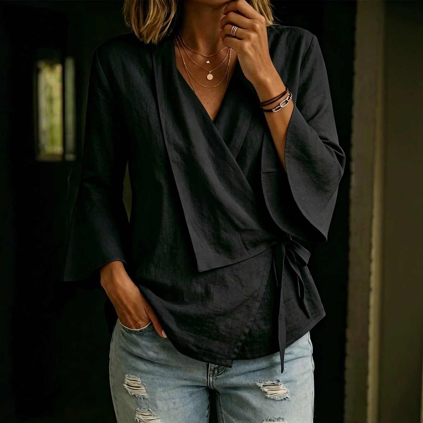 Asymmetric women's blouse with lapels and flared sleeves