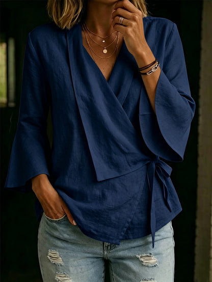 Asymmetric women's blouse with lapels and flared sleeves