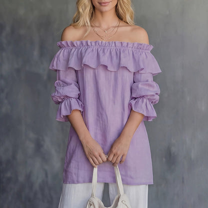 Top femenino asimétrico con volantes y mangas abullonadas - Fluido y elegante