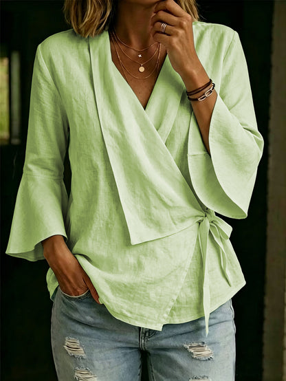Asymmetric women's blouse with lapels and flared sleeves