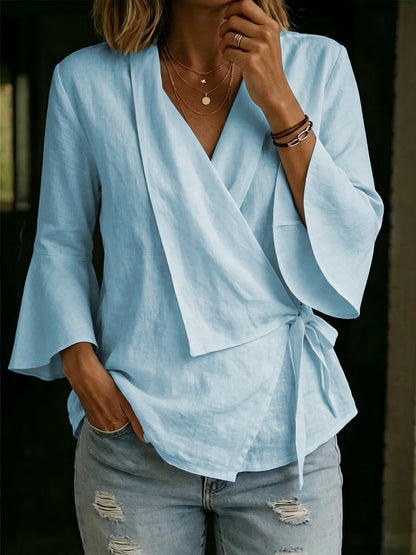 Asymmetric women's blouse with lapels and flared sleeves