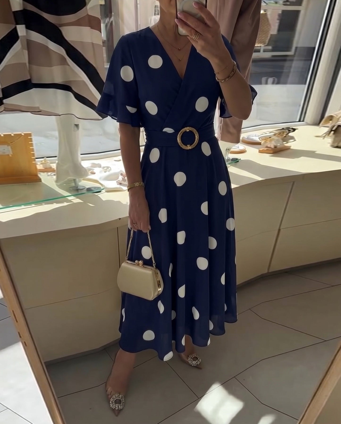 Fitted women's polka dot dress with V-neck - Flattering and feminine